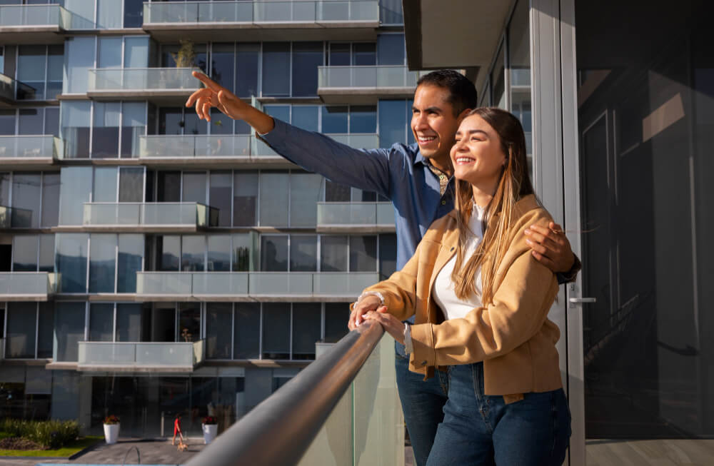 Condominium residents viewing building exterior highlighting structural safety and property condition assessment