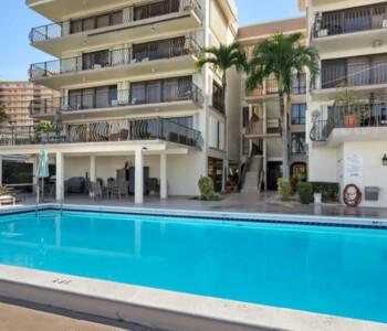 condominium building with pool inspected for restoration engineering and building recertification services in Florida